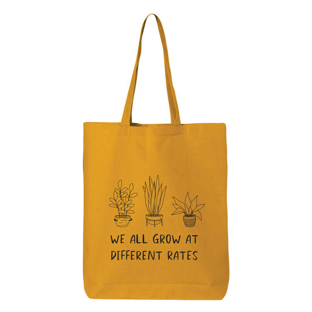 
                  
                    We All Grow At Different Rates Tote Bag
                  
                